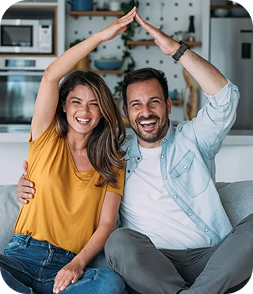 Couple making house shape